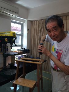 Hai Sin in his workshop at home.
