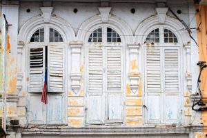 Window shutters in the charming old town disctrict of Ipoh, Malaysia. © coleong / Getty Images