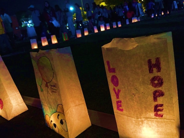 Luminaria Ceremony where participants remember those who have lost to cancer.